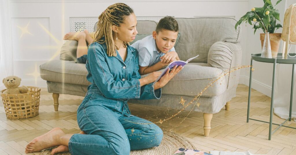 A mother reads with her child who is lying on a comfy sofa in their living room. A gentle homeschool reading approach.